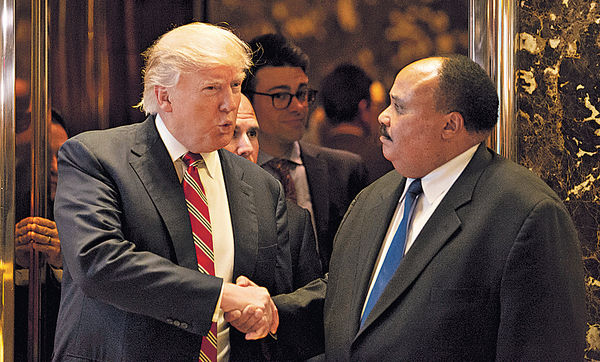 晤馬丁路德金子 特朗普急修補族裔裂痕