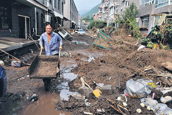 京暴雨33死18失蹤 129萬人受災 21萬房屋倒塌或受損 災區恢復需一年
